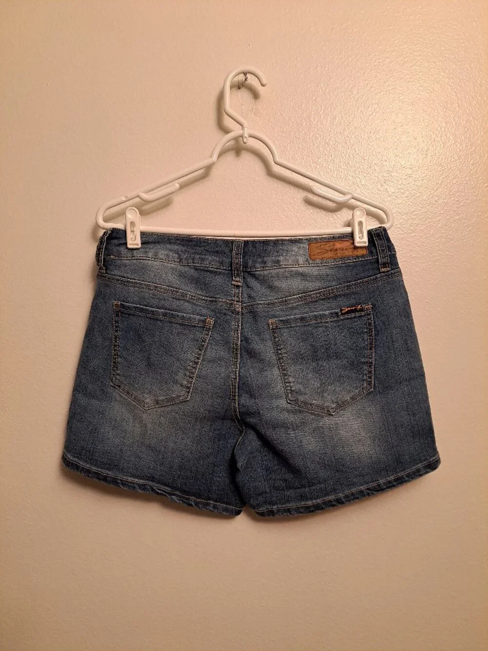 Seven7 Boho denim shorts featuring distinctive embroidered side detailing